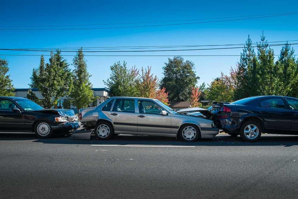 Who is at fault in a three-car accident?